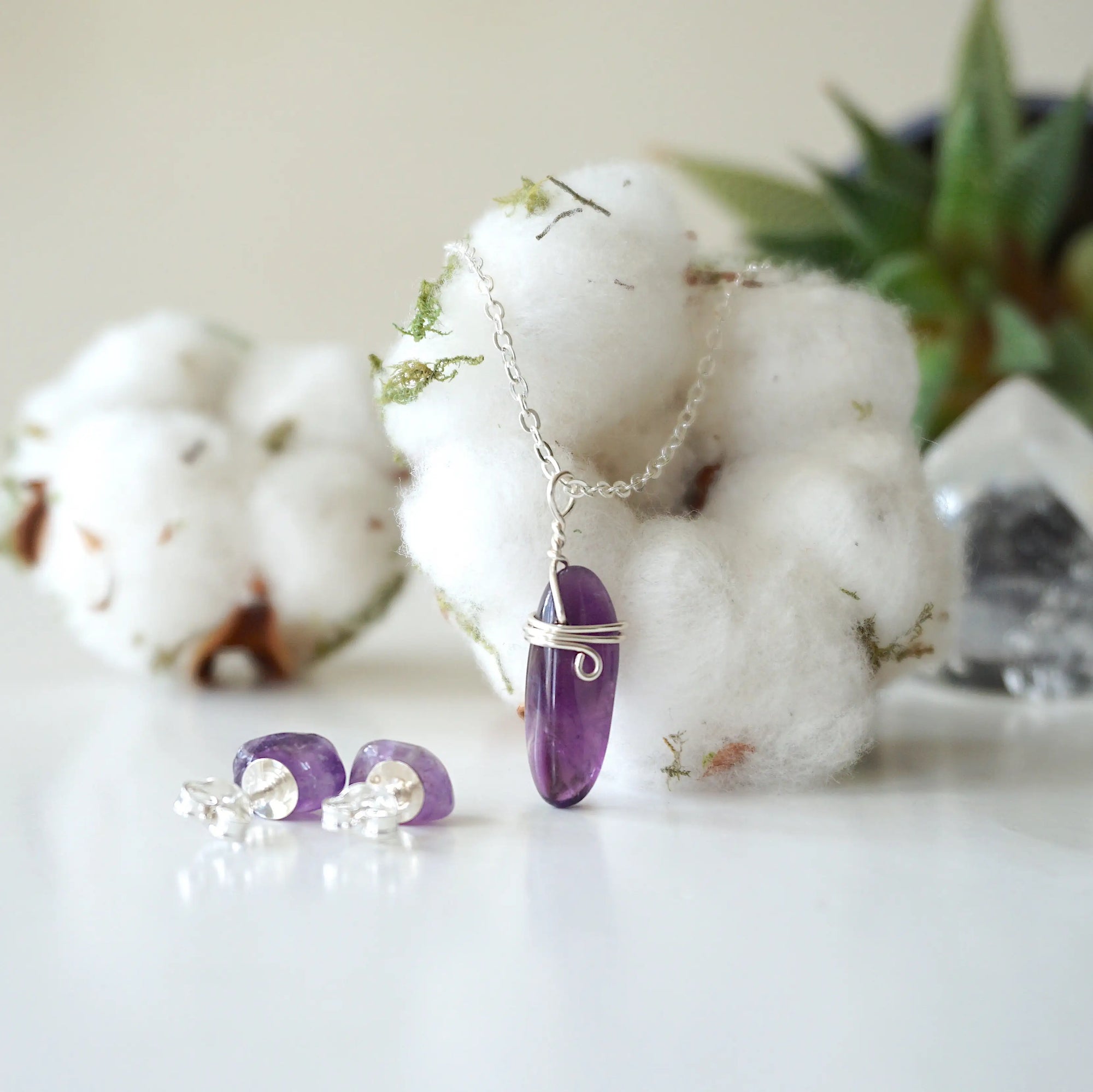 Front angle of amethyst pendant necklace with back view of amethyst stud earrings, minimalist silver jewelry set for women