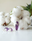 Front angle of amethyst pendant necklace with back view of amethyst stud earrings, minimalist silver jewelry set for women