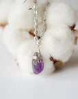 Detailed front view of minimalist amethyst necklace for women, raw amethyst pendant wire wrapped in silver plated copper