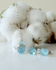 Detailed look at minimalist aquamarine necklace and stud earrings, genuine aquamarine, soft silver and sterling silver settings, artisan handcrafted