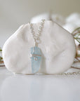 Minimalist aquamarine necklace, detailed front view, genuine polished aquamarine wrapped in soft silver finish over copper wire, March birthstone, Designs by Nature Gems