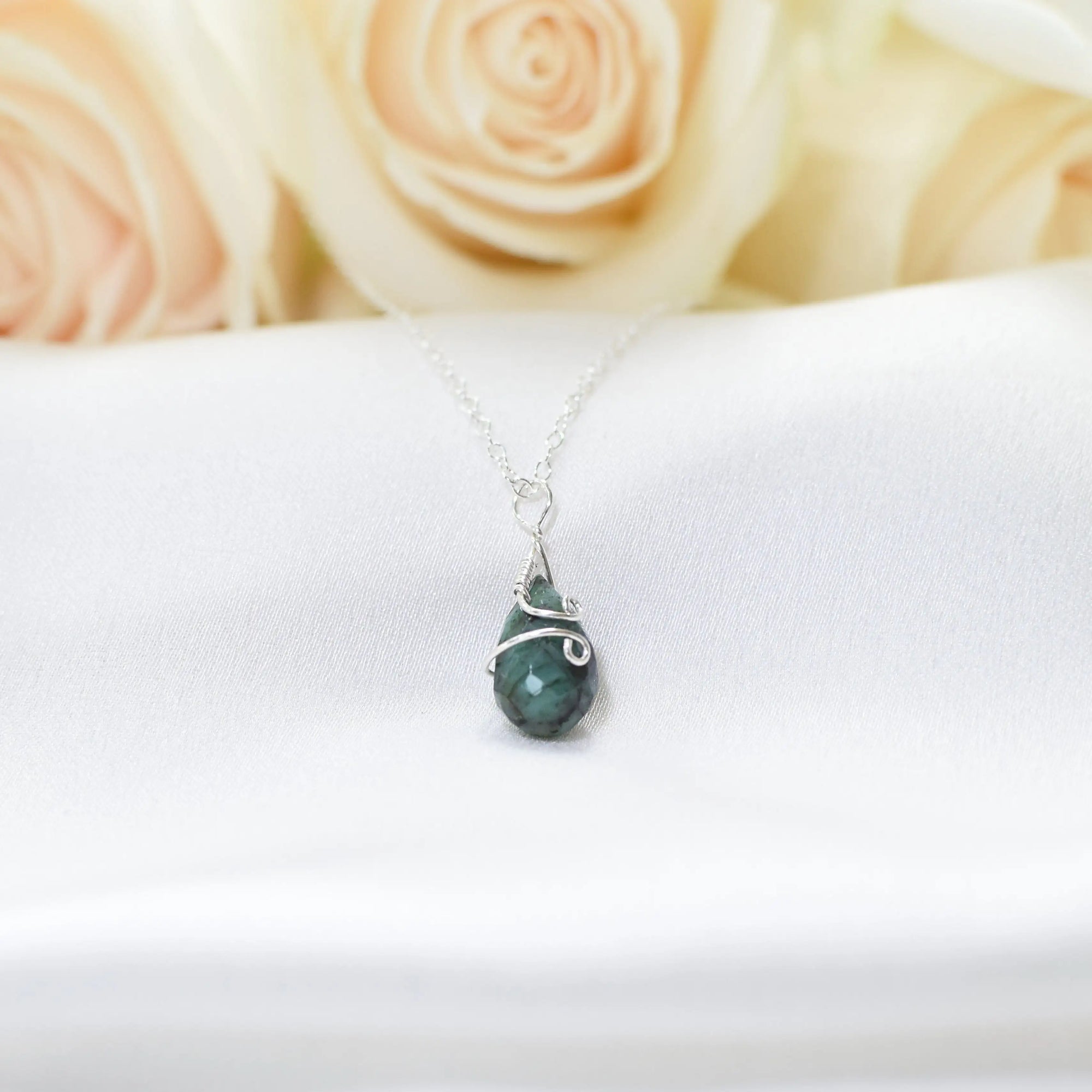 Minimalist emerald necklace for women with natural faceted teardrop emerald in 925 sterling silver, detailed front view