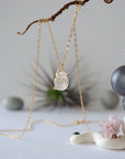 Detailed front view of minimalist Herkimer diamond necklace in gold vermeil with natural raw crystal pendant.