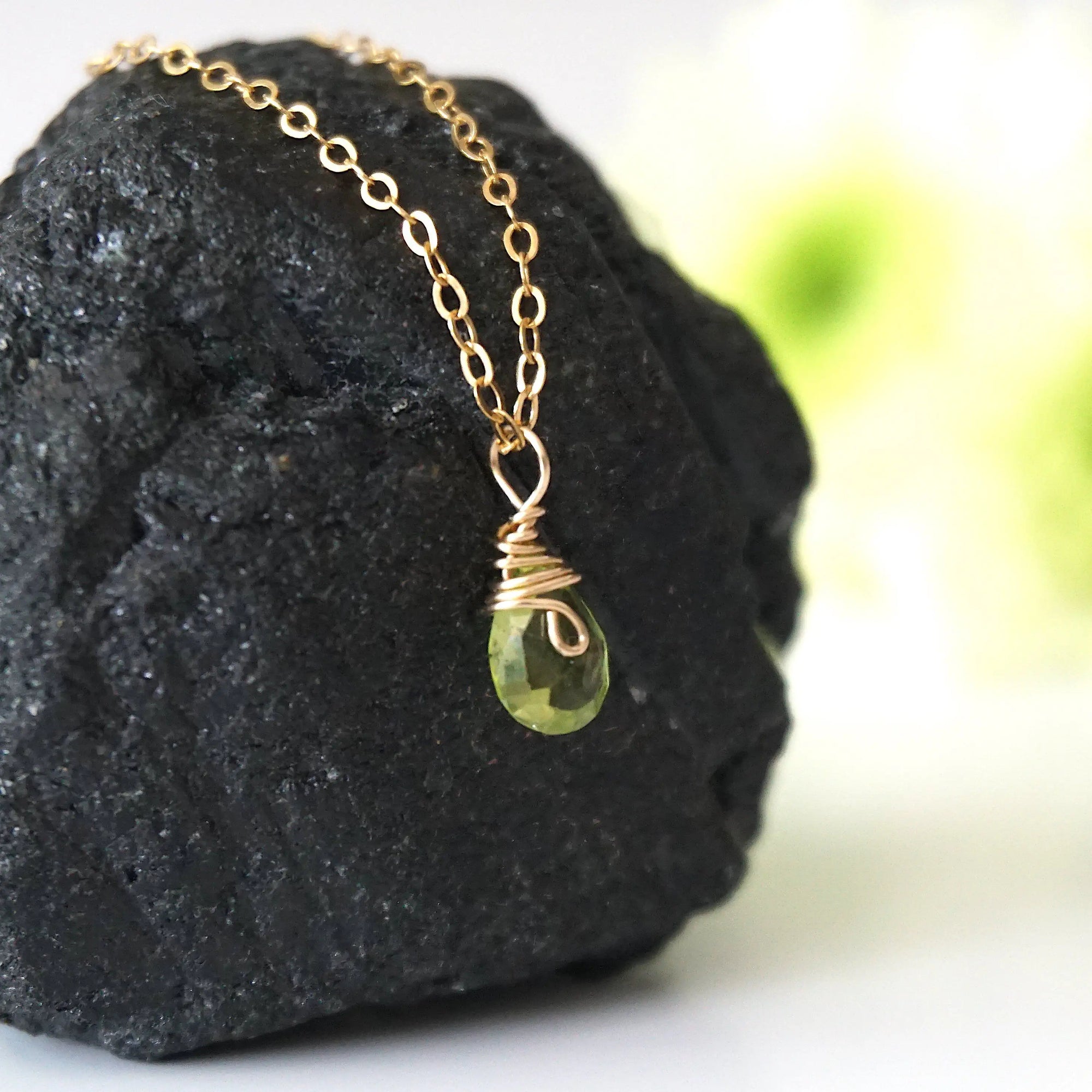 Right side detail of minimalist peridot pendant — 14k gold filled wire wrap bail, faceted natural peridot crystal, handcrafted dainty August birthstone necklace for women