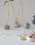 Side angle detail of minimalist raw amethyst necklace in gold vermeil, natural unpolished amethyst stone pendant