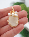 Moonstone and freshwater pearl necklace pendant in hand for size reference, artisan birthstone jewelry gift for her