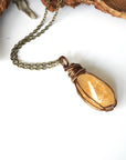 Natural citrine necklace on antique bronze copper chain laying flat - handmade wire wrapped crystal pendant unisex jewelry for women and men November birthstone
