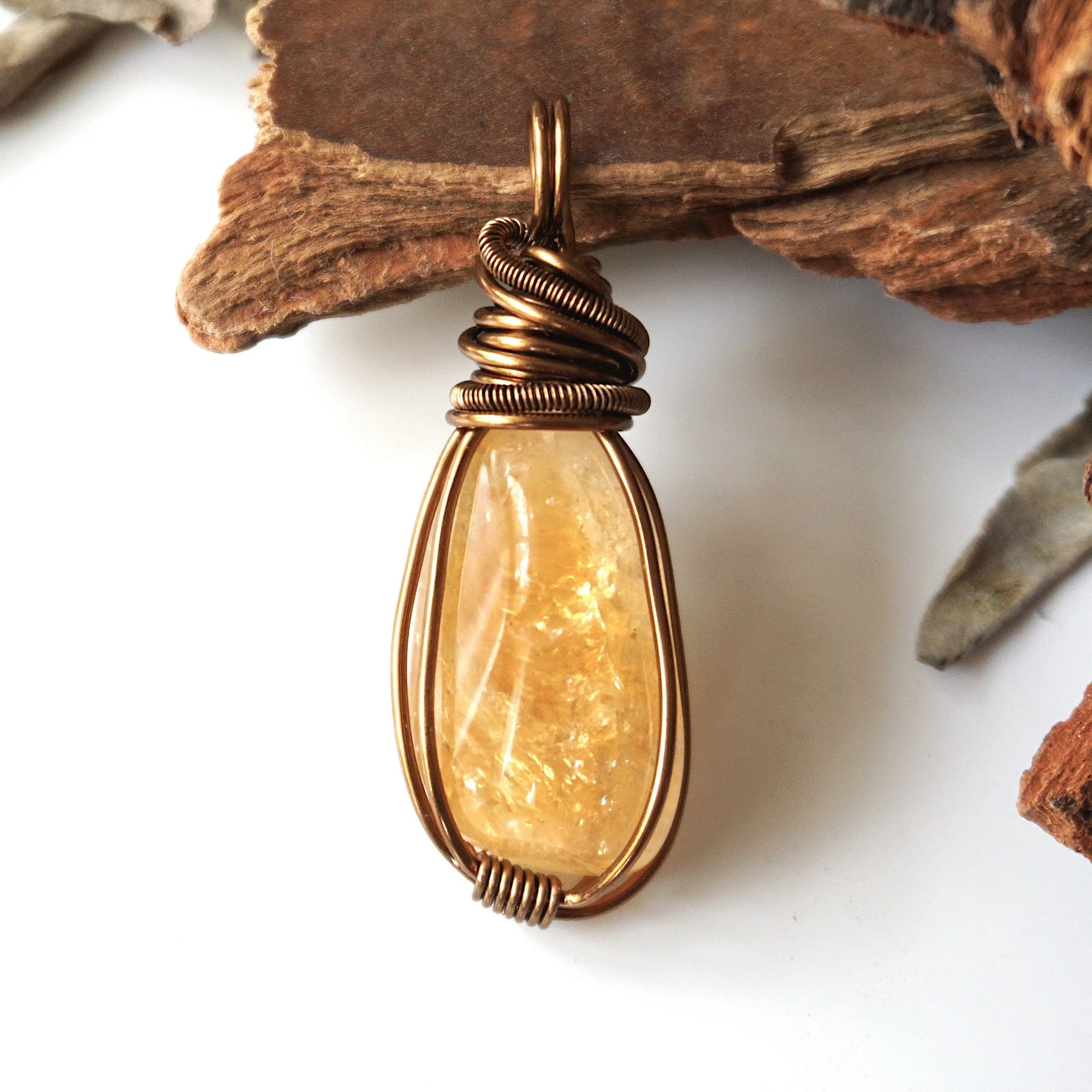 Front view of natural citrine pendant showing crystal texture and wire wrapping - antique bronze copper handmade unisex jewelry for women and men November birthstone detail