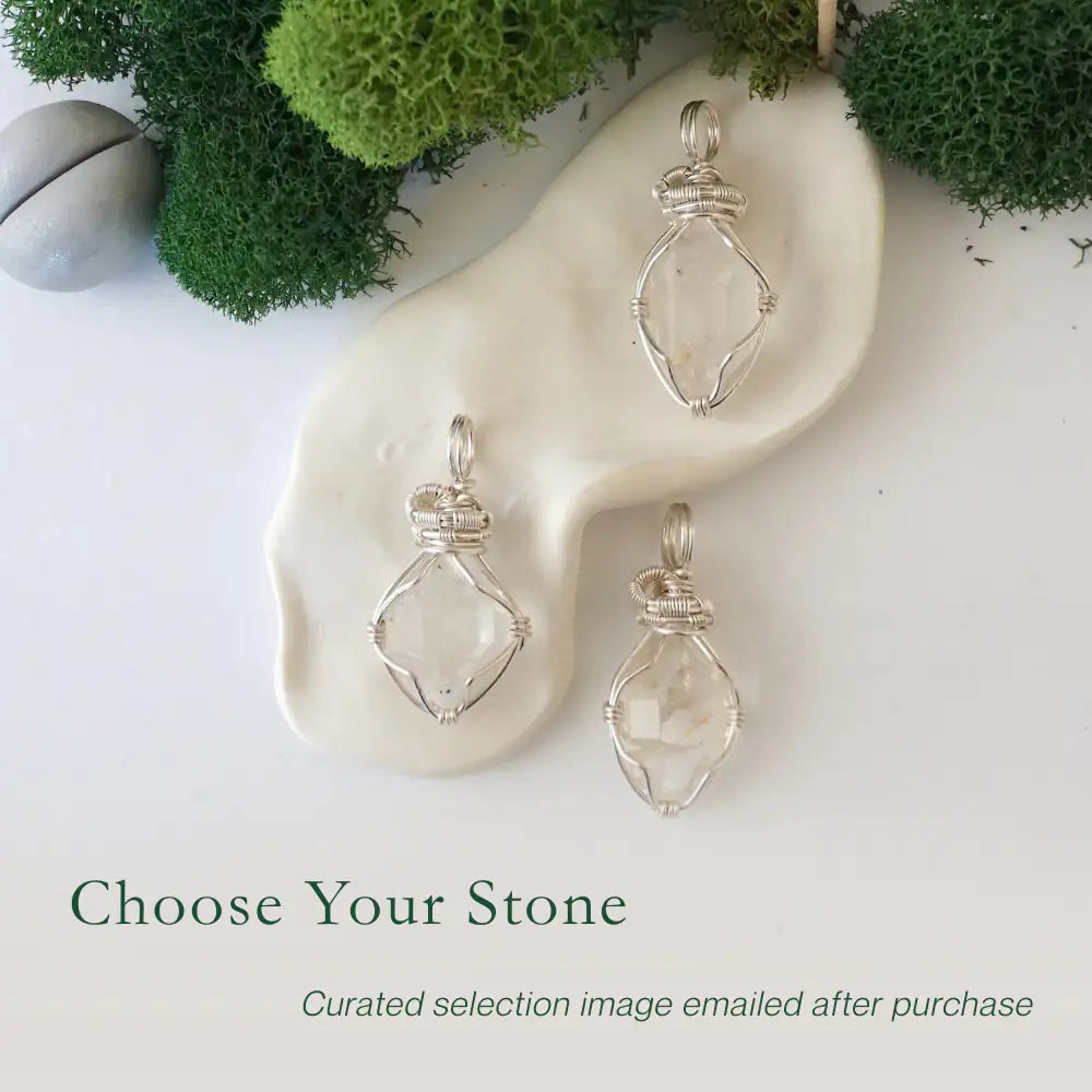 Three Herkimer diamond pendants showing natural variation in crystal size, shape, and handcrafted wire wrapping.