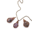 Three natural raw ruby pendants side by side showing unique variation in size, shape, and colour — each one of a kind by nature