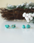 Two pairs of natural turquoise stud earrings showing unique stone variations - each handmade pair features one-of-a-kind turquoise matrix patterns