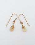 Side angle of opal drop earrings, minimalist artisan wire wrapping, 14k gold filled