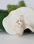 Detailed front view of silver wire wrapped opal and freshwater pearl pendant, unique artisan necklace