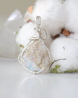 Back side angle view of sterling silver opal pendant, handcrafted jewelry by Designs by Nature Gems.
