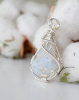 Left side angle detail of sterling silver opal pendant, artisan wire wrapped by Designs by Nature Gems.
