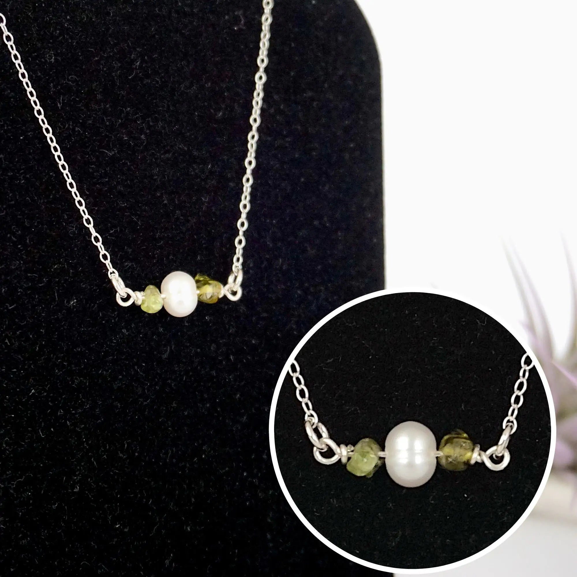 Close-up of raw peridot stones and freshwater pearl bar on 925 sterling silver necklace