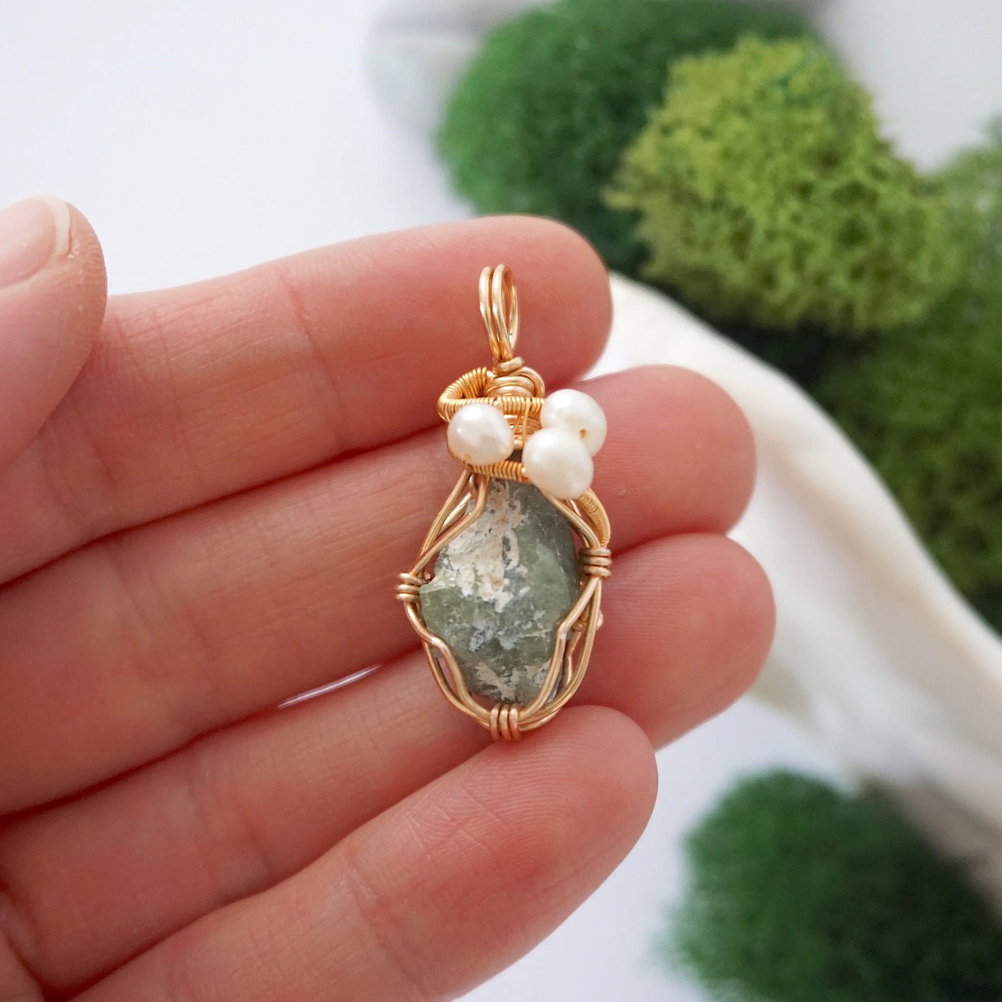 Peridot and freshwater pearl necklace pendant in hand for size reference, artisan birthstone jewelry gift for her