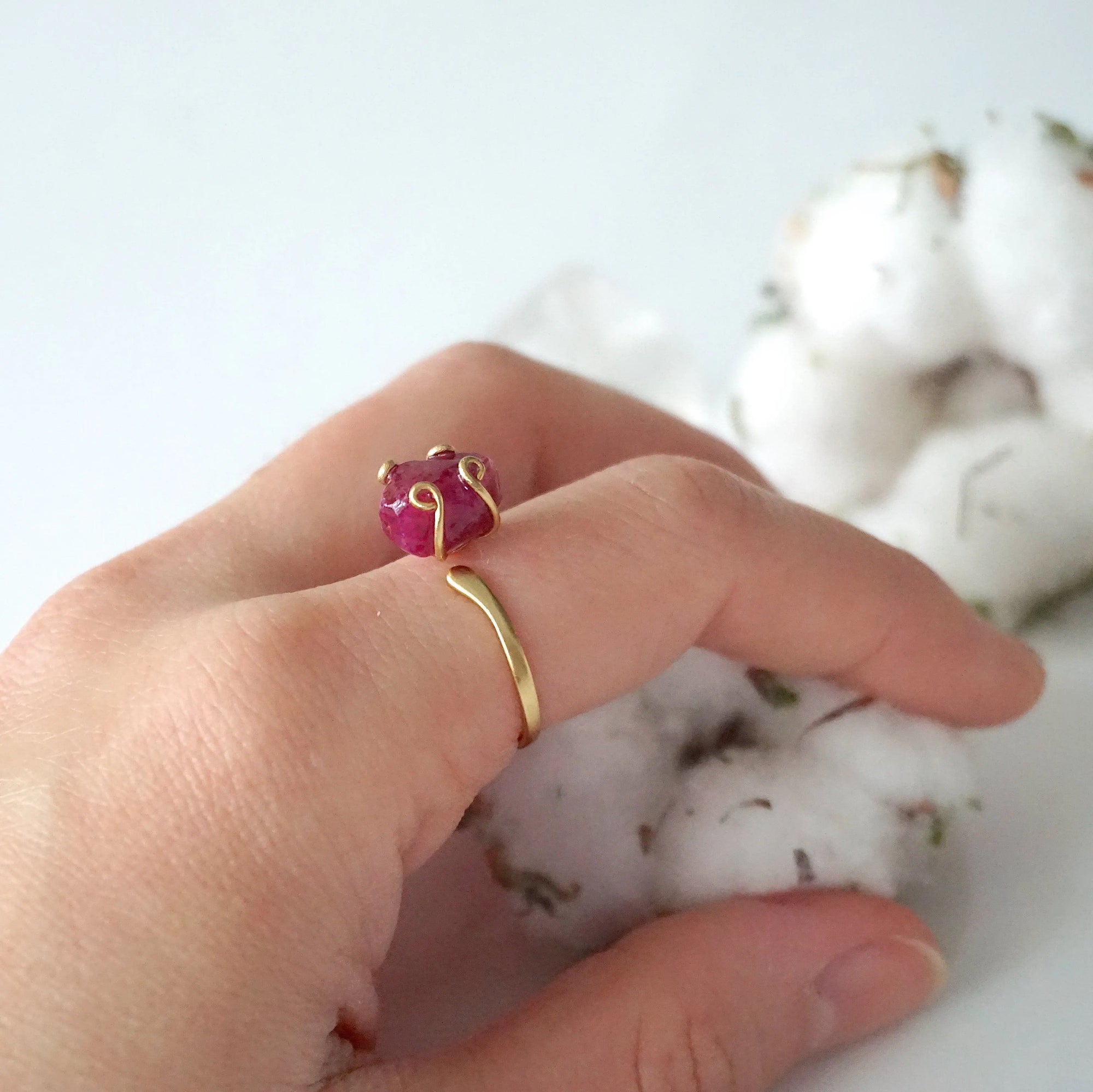 Pink ruby adjustable ring in 14k gold vermeil worn on female model's hand — raw crystal ring for women, one of a kind by nature