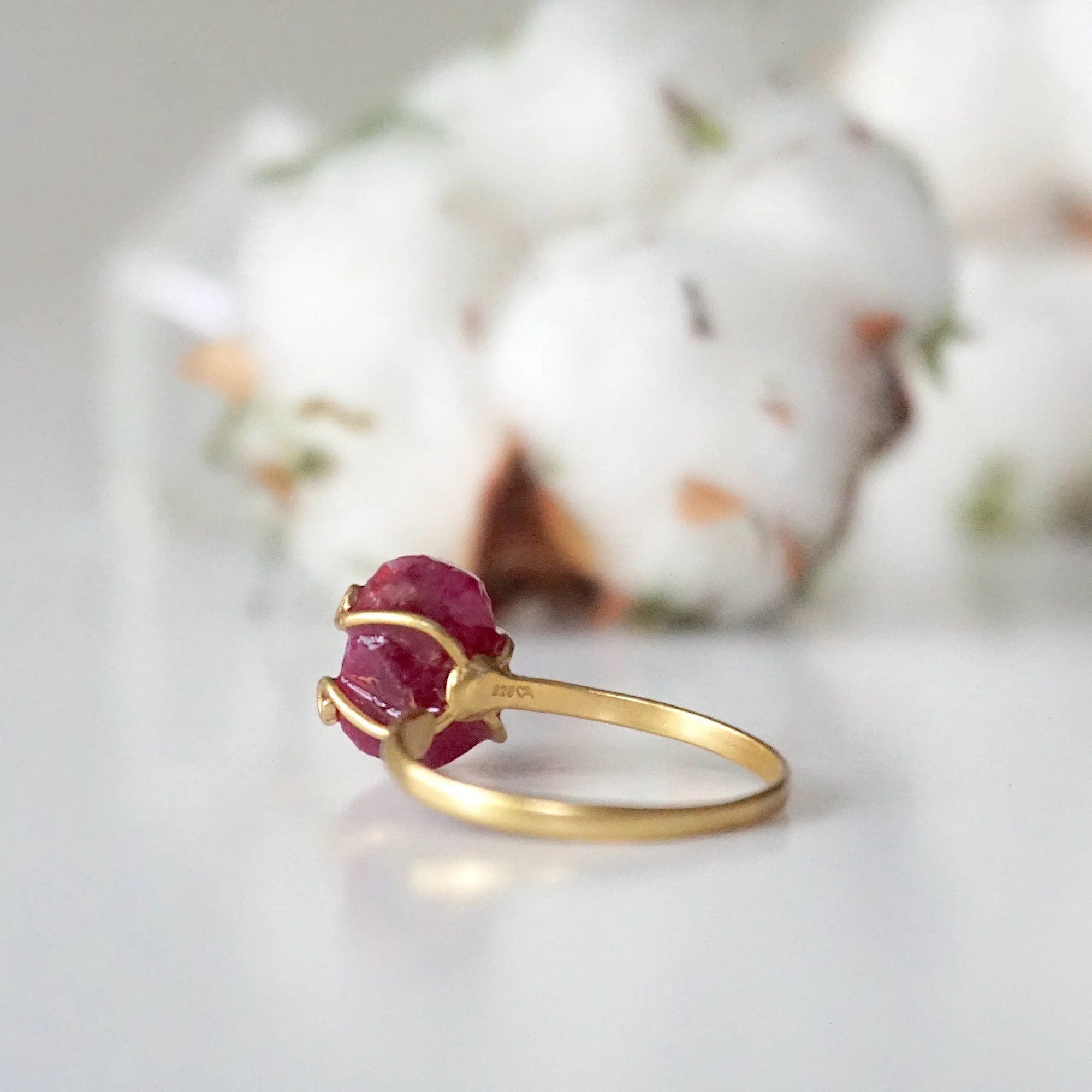 Back view of pink ruby adjustable ring showing 14k gold vermeil open band — adjustable crystal ring fits US sizes 4 to 10