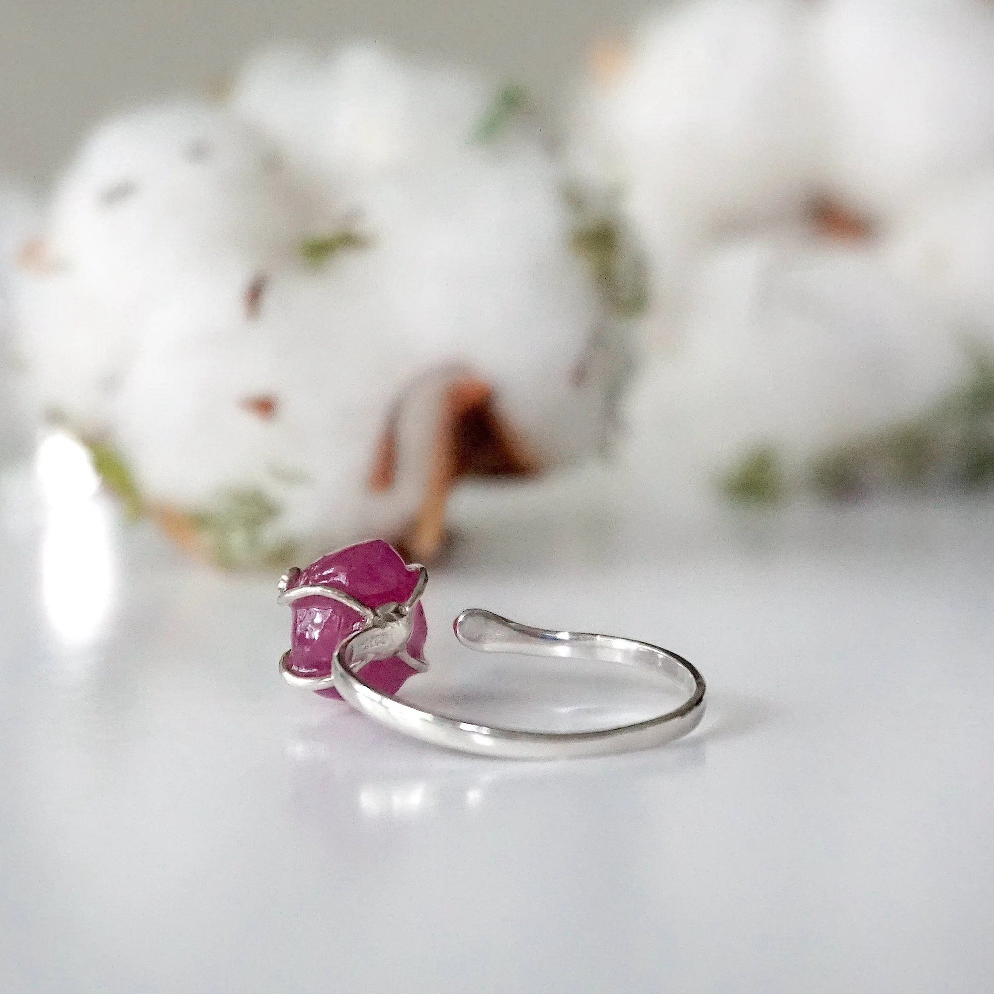 Back view of pink ruby adjustable ring showing 925 sterling silver open band — adjustable crystal ring fits US sizes 4 to 10