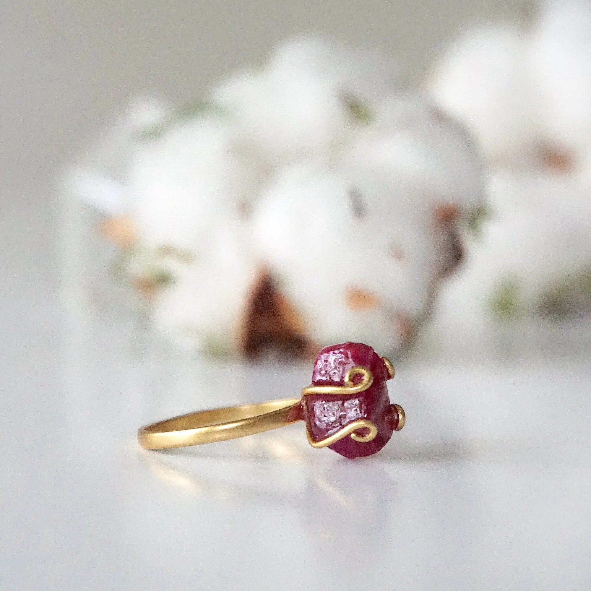 Left side view of pink ruby adjustable ring highlighting natural raw stone and slim 14k gold vermeil band — July birthstone ring