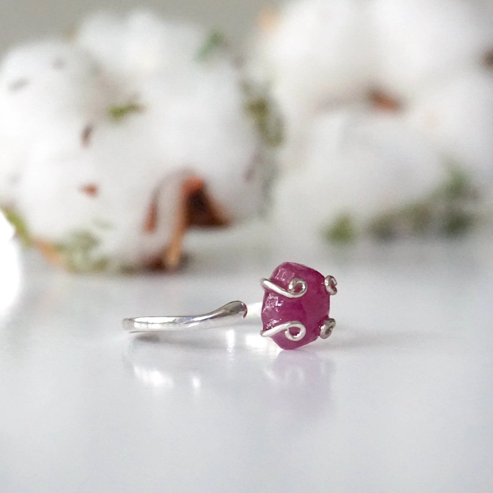 Right side view of raw pink ruby adjustable ring showing sterling silver band and stone setting — minimalist natural crystal ring for women