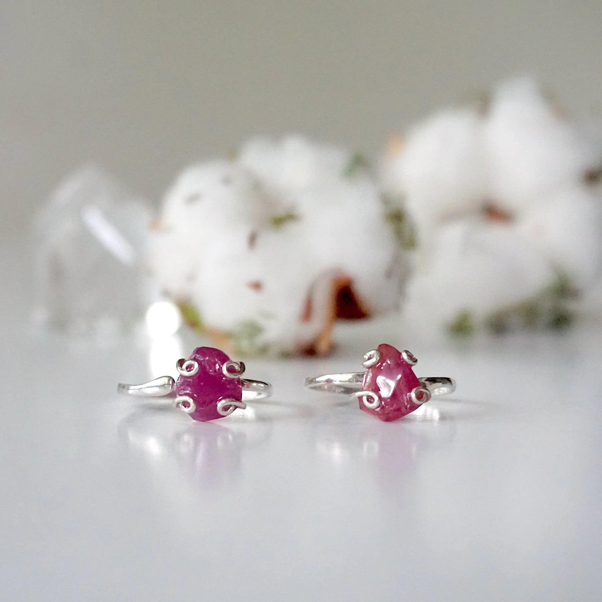 Two pink ruby adjustable rings showing natural variation in stone size, shape, and colour — choose your ruby ring, one of a kind by nature