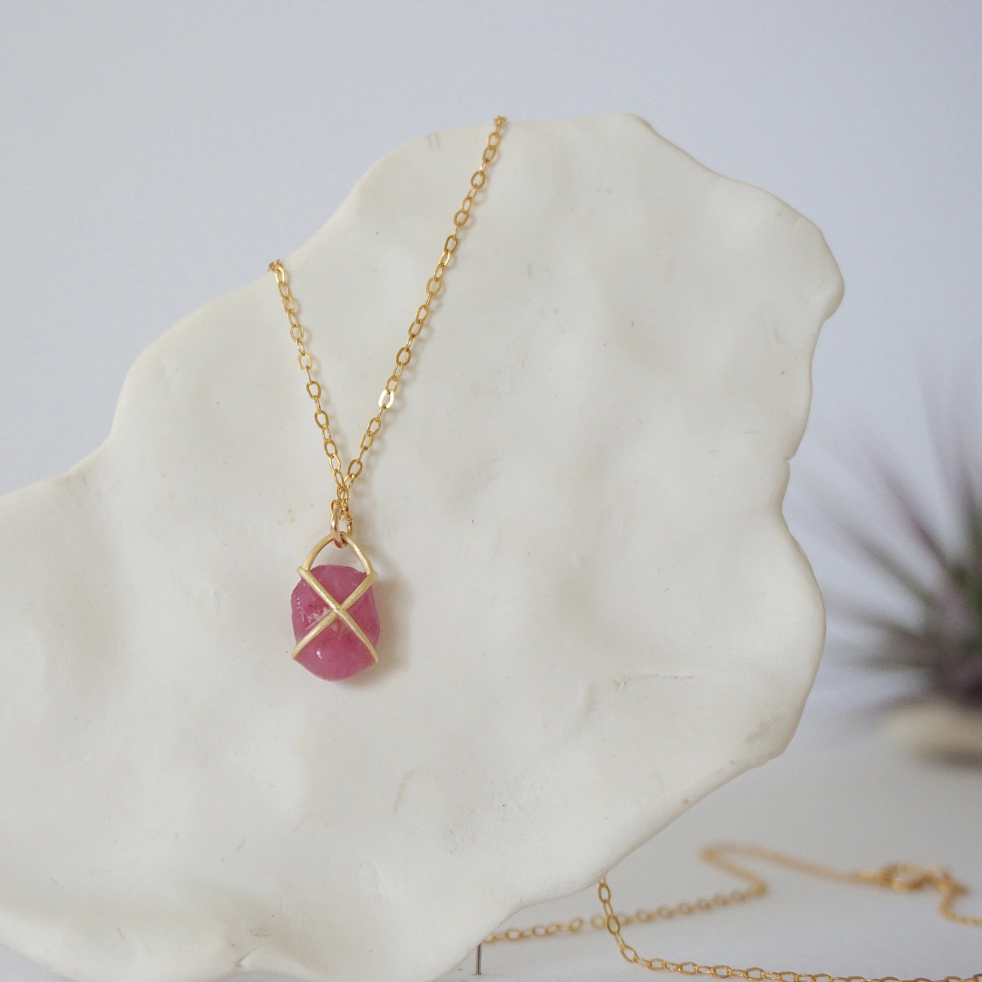Back angle of natural pink ruby pendant in 14k gold vermeil prong setting — minimalist handmade crystal necklace, gold filled chain