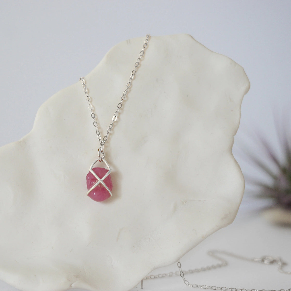Back angle of natural pink ruby pendant in sterling silver prong setting — minimalist handmade crystal necklace, 925 sterling silver