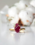 Front view of pink ruby adjustable ring showing natural raw ruby stone in curled 14k gold vermeil setting — handmade crystal ring for women