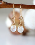 Detailed front view of rainbow moonstone drop earrings, genuine faceted rainbow moonstone with minimalist 14k gold filled wire wrapping, Designs by Nature Gems