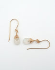 Side angle of rainbow moonstone drop earrings, minimalist artisan wire wrapping, 14k gold filled
