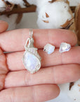 Rainbow moonstone necklace and stud earrings set in hand for size reference, sterling silver pendant and raw moonstone studs (June birthstone).