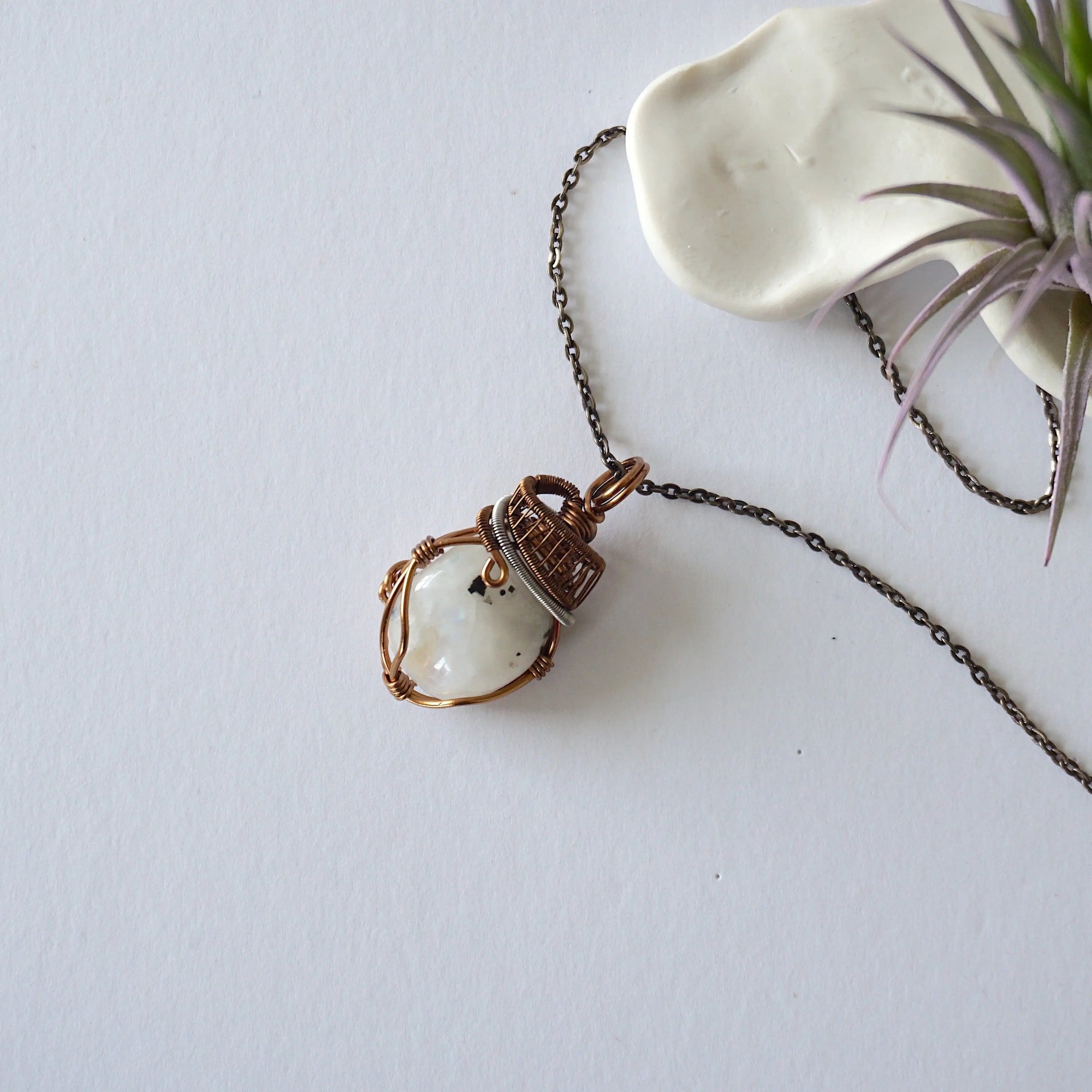 Rainbow moonstone necklace for women with antique bronze and dark silver wire wrapped June birthstone pendant