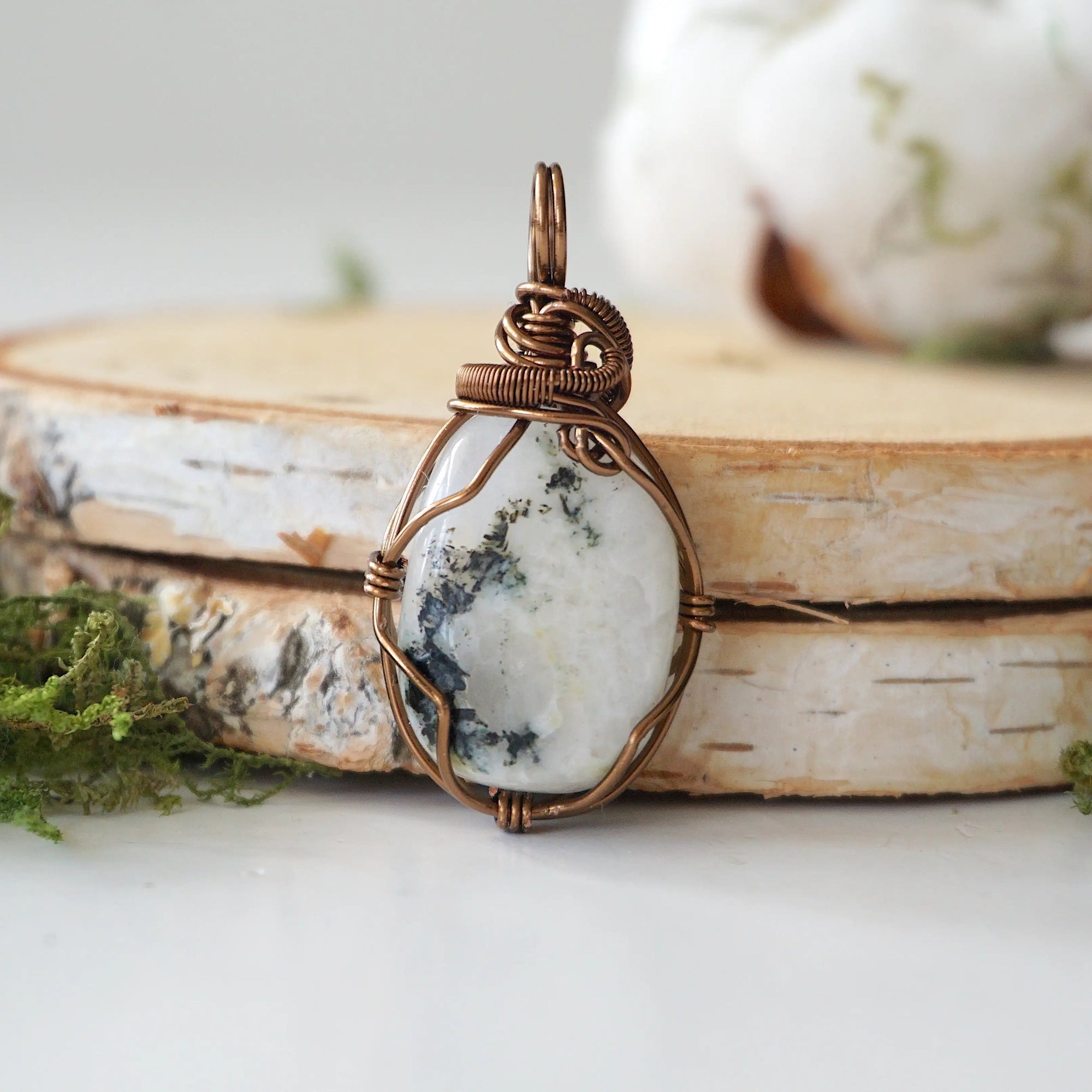 Back view of rainbow moonstone pendant necklace showing secure handcrafted antique bronze finish over copper wire wrapping