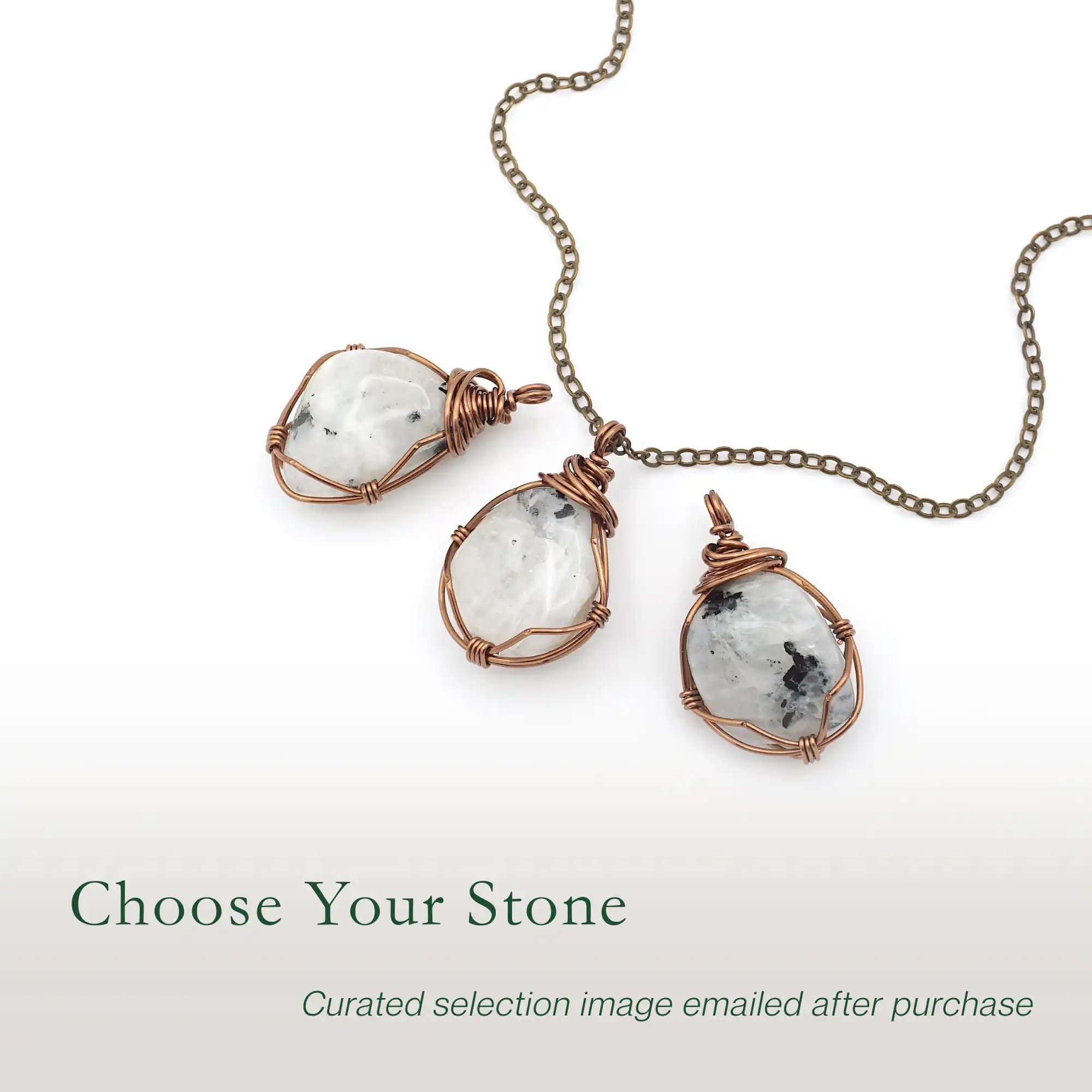 Three rainbow moonstone pendants showing natural variation in size shape and colour in handcrafted artisan jewelry