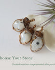 Three rainbow moonstone pendants showing natural variation in size shape and colour in handmade artisan jewelry