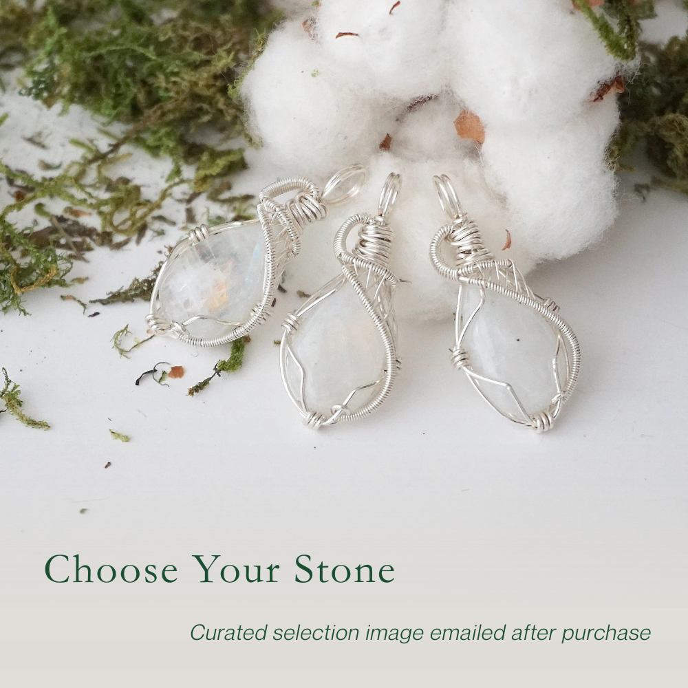 Three rainbow moonstone pendants showing natural variation in size and flash in handmade artisan jewelry