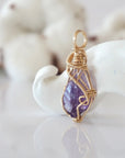 Side view of raw amethyst pendant in 14k gold filled, showing artisan wire wrapping. Handcrafted February birthstone necklace by Designs by Nature Gems.