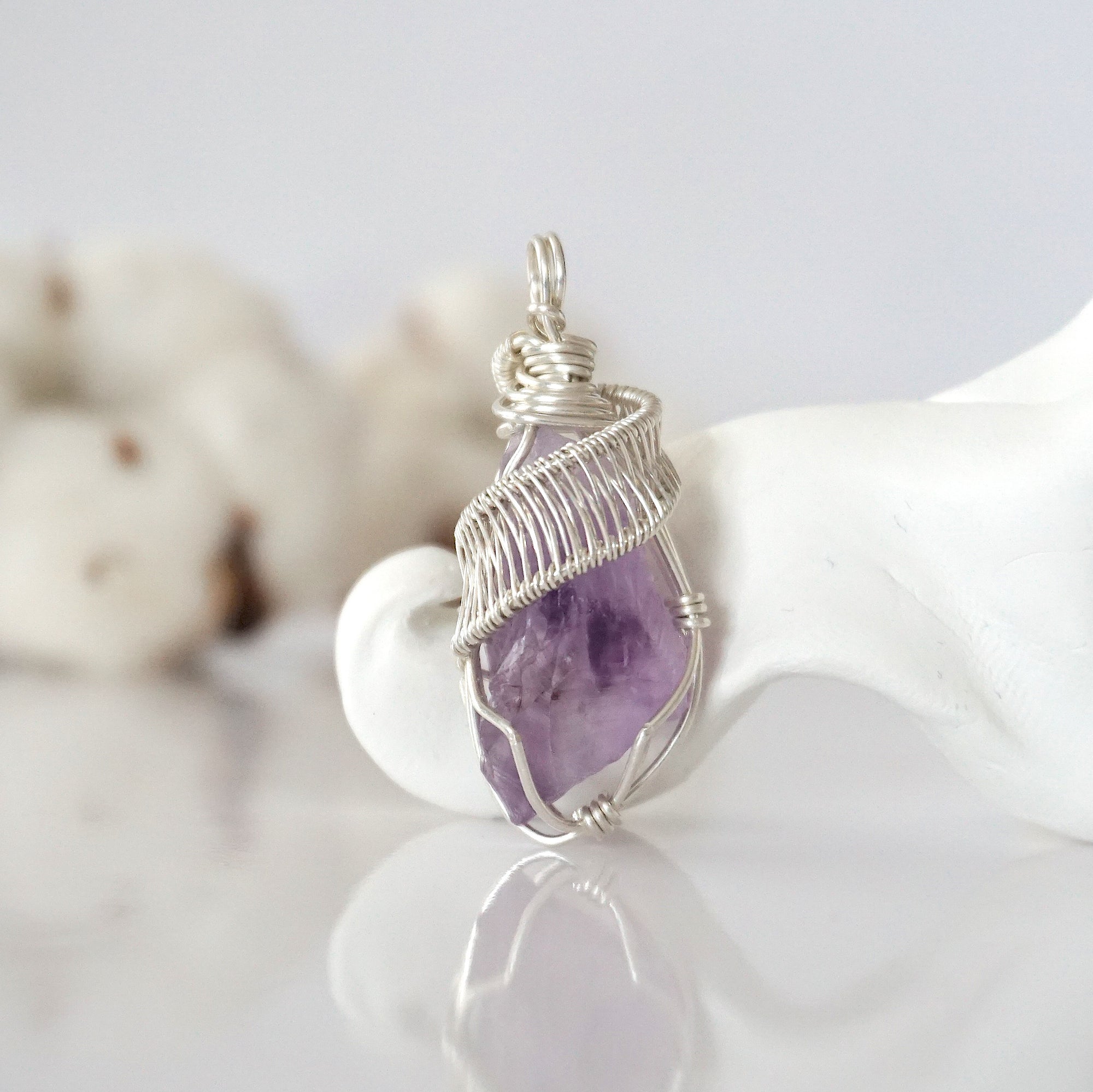 Back view of raw amethyst wire wrapped pendant — 925 sterling silver hand-wrapped setting, shows craftsmanship and secure stone hold, handmade in Toronto Canada