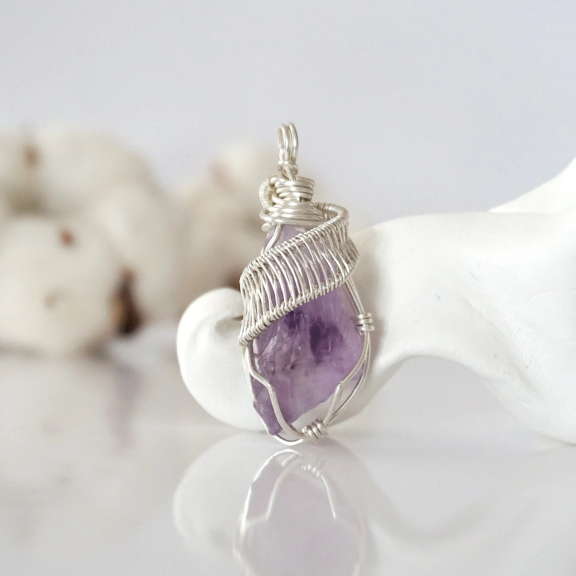 Back view of raw amethyst wire wrapped pendant — 925 sterling silver hand-wrapped setting, shows craftsmanship and secure stone hold, handmade in Toronto Canada