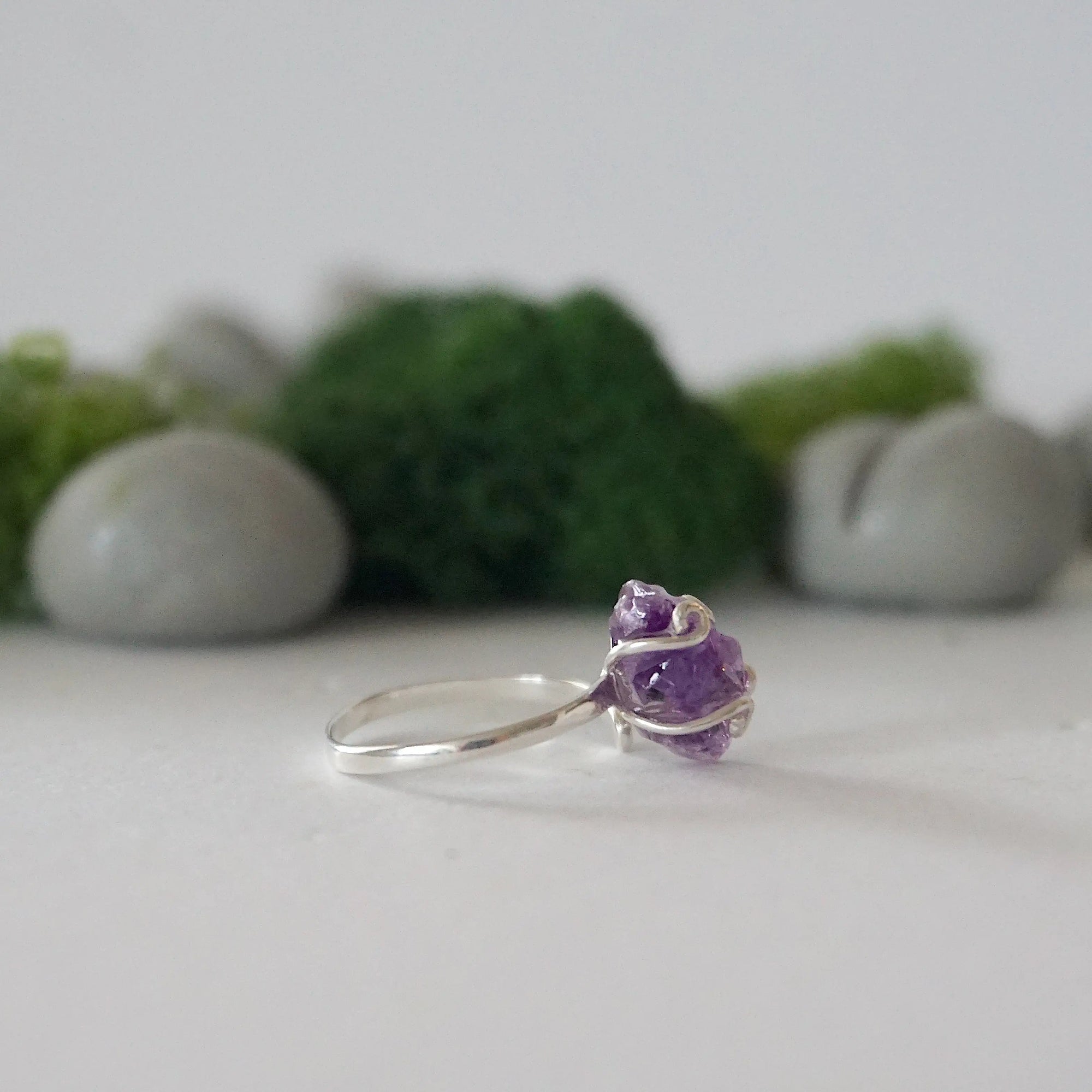 Right side detail of raw amethyst ring in sterling silver claw setting, natural crystal birthstone ring