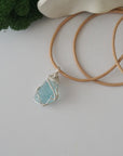 Raw aquamarine necklace for women — handmade 925 sterling silver wire wrapped pendant on genuine tan leather cord, March birthstone, by Designs by Nature Gems