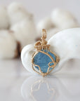 Detailed front view of raw aquamarine pendant in 14k gold filled. Unique wire wrapped March birthstone jewelry by Designs by Nature Gems.