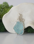 Back view of raw aquamarine wire wrapped pendant — 925 sterling silver hand-wrapped setting, shows craftsmanship and secure stone hold, handmade in Toronto Canada