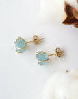 Top view of raw aquamarine stud earrings, showing prong setting and earring closure, gold vermeil