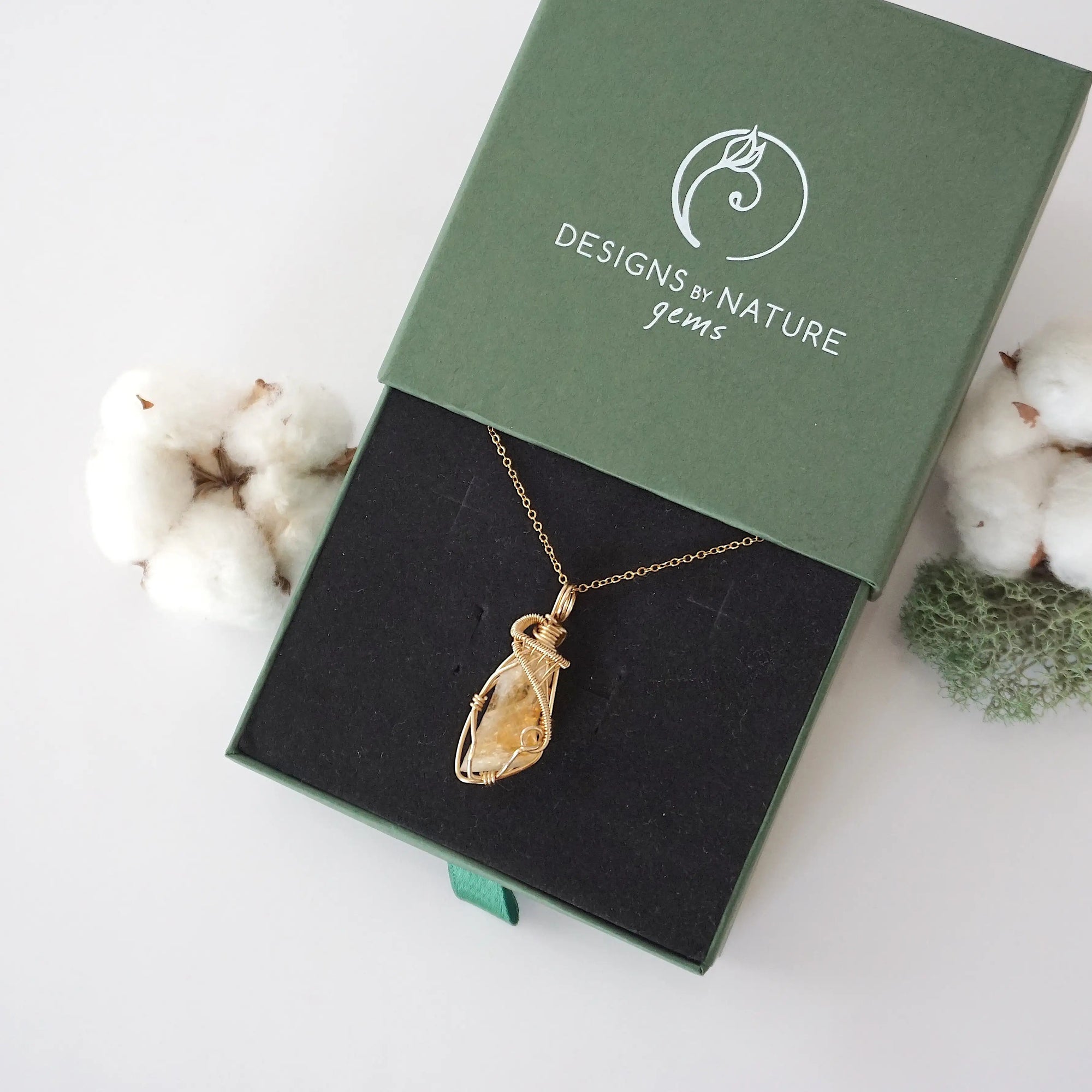 Raw citrine necklace in 14k gold filled displayed in branded Designs by Nature Gems jewelry box. Artisan November birthstone gift for women.