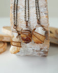 Three raw citrine necklaces antique bronze showing natural stone size shape and color variation unisex jewelry
