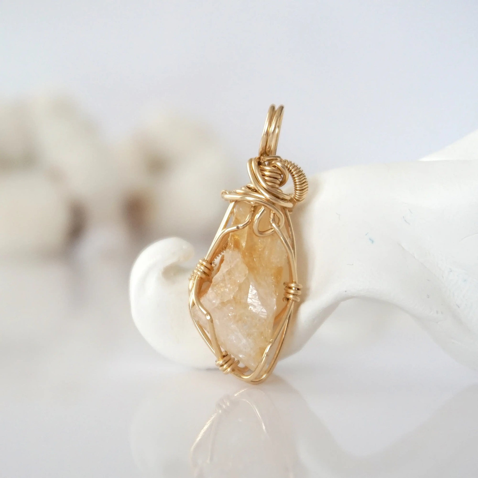 Back view of raw citrine pendant in 14k gold filled, highlighting stone and wire detail. One of a kind November birthstone jewelry by Designs by Nature Gems.