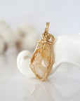 Back view of raw citrine pendant in 14k gold filled, highlighting stone and wire detail. One of a kind November birthstone jewelry by Designs by Nature Gems.